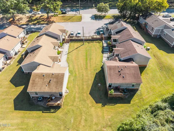 an aerial view of residential house with swimming pool