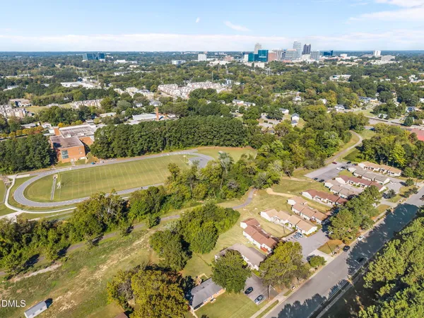 an aerial view of residential houses with outdoor space