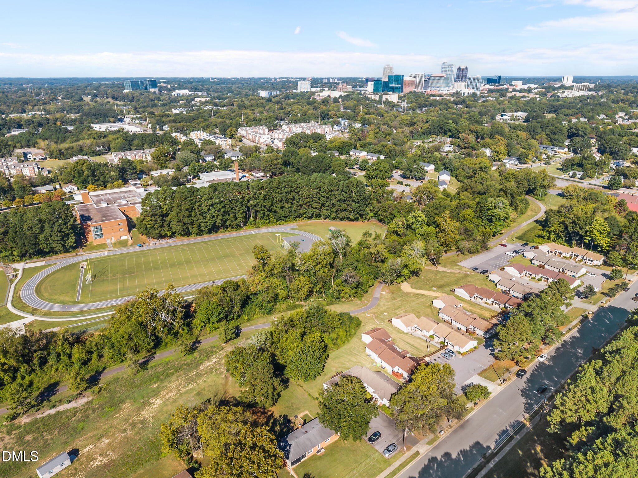 1316 South State Street, Unit D Raleigh, NC 27610 - Photo 4 of 36 an aerial view of residential houses with outdoor space