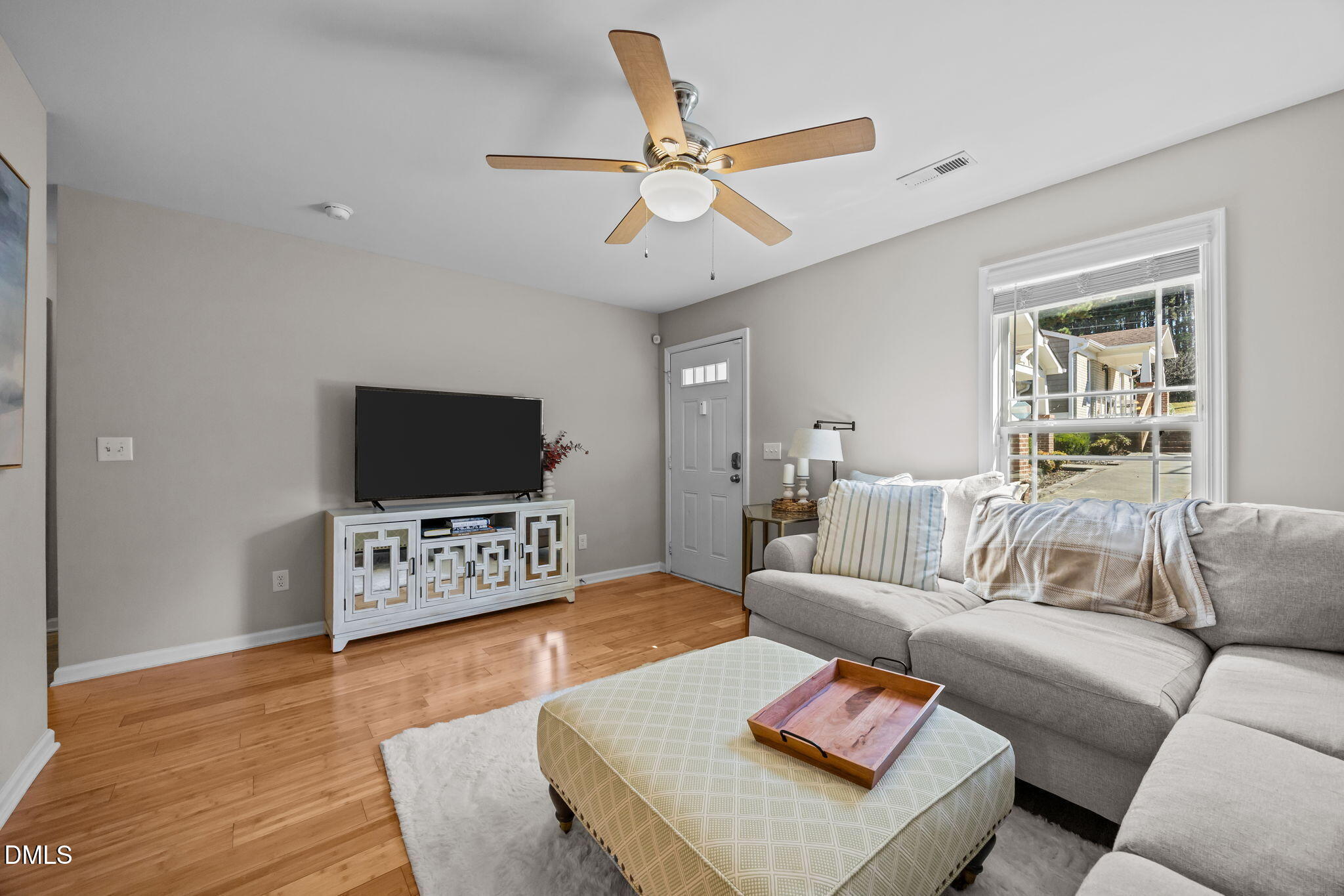 1316 South State Street, Unit D Raleigh, NC 27610 - Photo 7 of 36 a living room with furniture and a flat screen tv