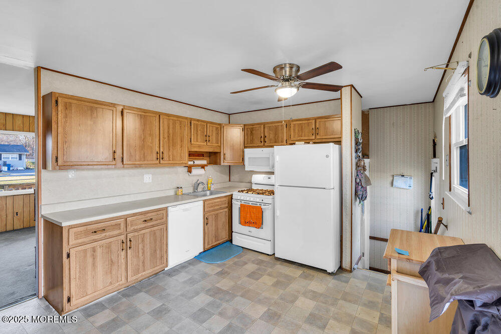 2 Drew Court Jackson, NJ 08527 - Photo 12 of 26 a kitchen with refrigerator cabinets and window