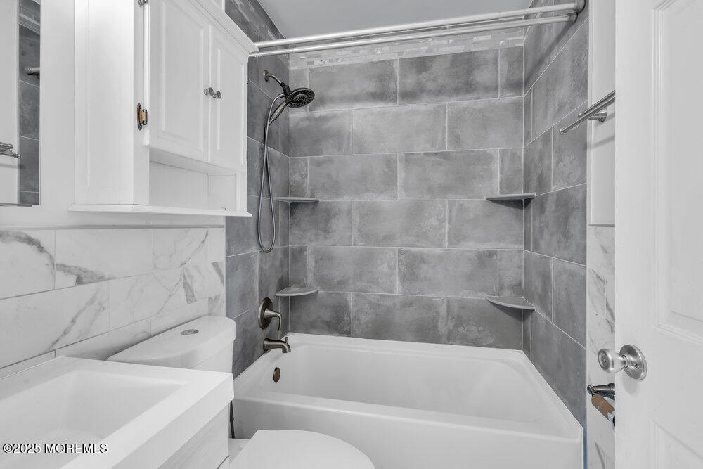 2 Drew Court Jackson, NJ 08527 - Photo 16 of 26 a bathroom with a bathtub and a shower