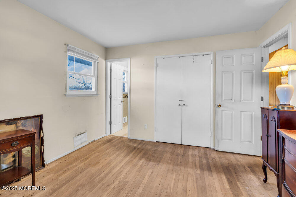 2 Drew Court Jackson, NJ 08527 - Photo 19 of 26 a view of empty room with wooden floor and fan