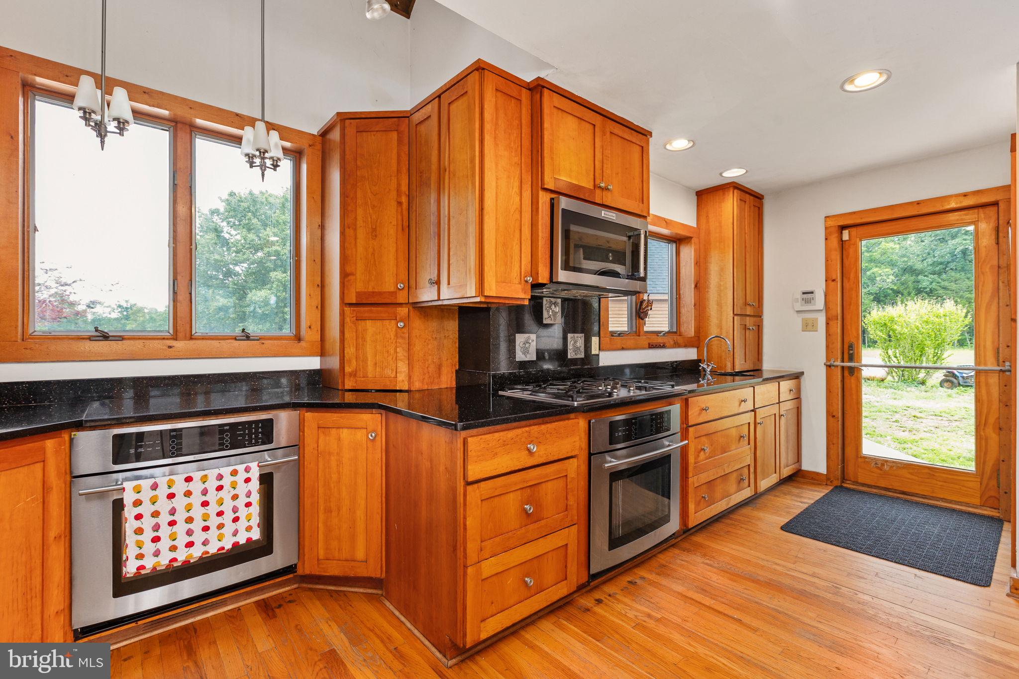 6119 Beach Road Midland, VA 22728 - Photo 34 of 98 a kitchen with stainless steel appliances a stove sink and cabinets