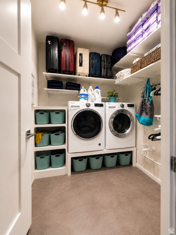 283 South Buffalo Ranch Road Farmington, UT 84025 - Photo 8 of 10 Dedicated laundry room featuring a front-loading washer and dryer, integrated shelving, and track lighting