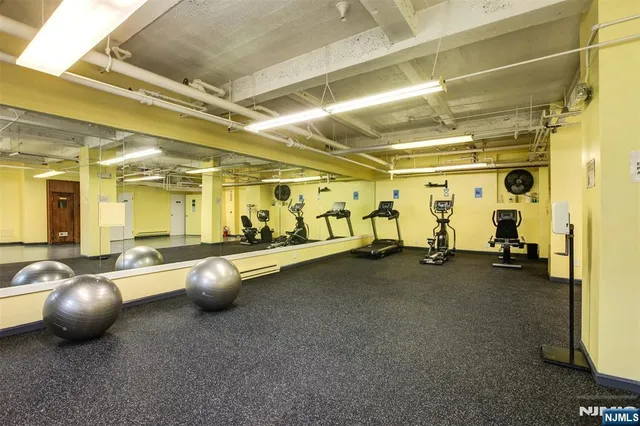 a utility room with multiple dryer and washer