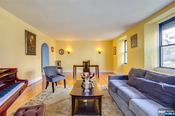 a view of a dining room with furniture and a window