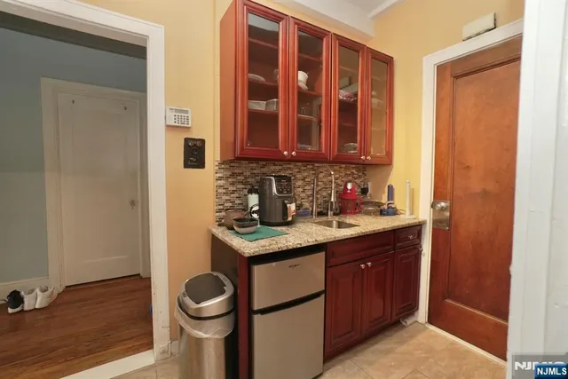 a kitchen with a stove a sink and a microwave