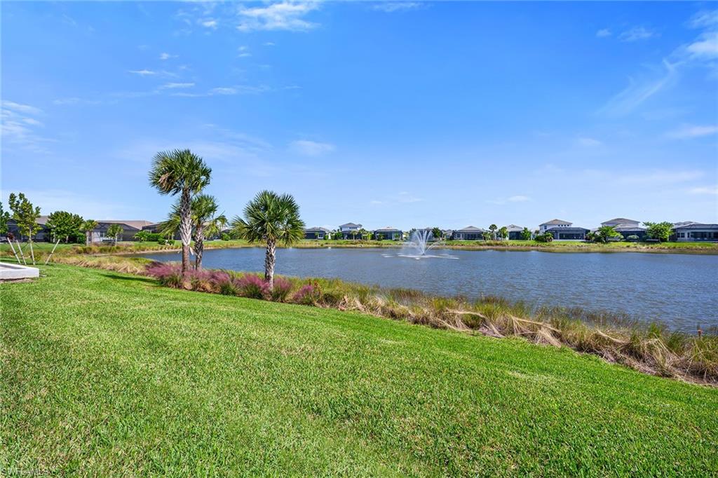 9020 Mayreau Way Naples, FL 34114 - Photo 15 of 28 a view of a lake with houses in the back