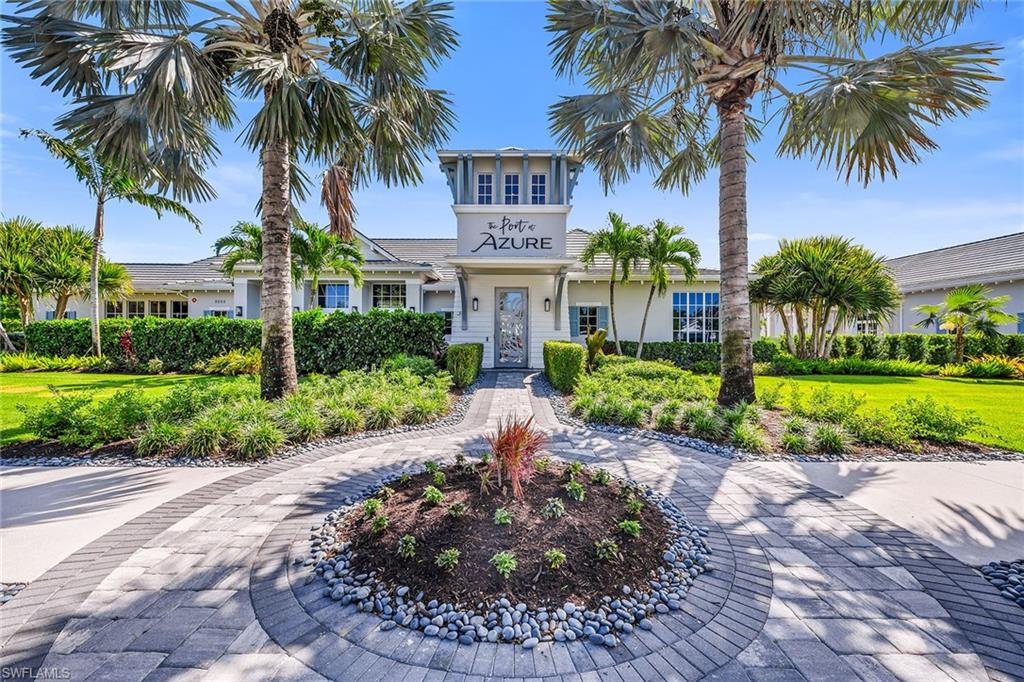 9020 Mayreau Way Naples, FL 34114 - Photo 17 of 28 front view of a house with a yard and palm trees