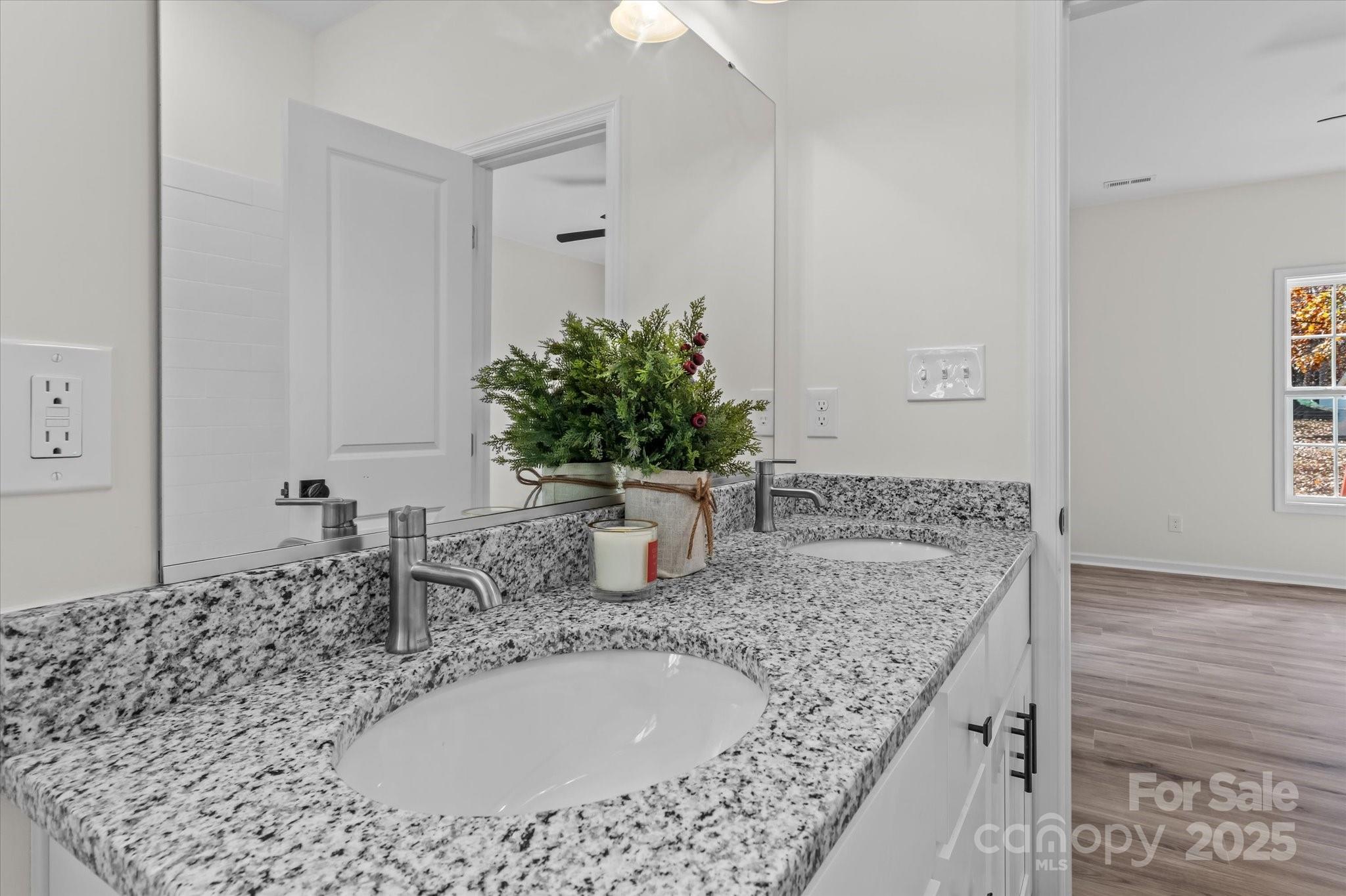402 North Ward Avenue High Point, NC 27262 - Photo 14 of 24 a bathroom with a granite countertop sink a mirror and vanity