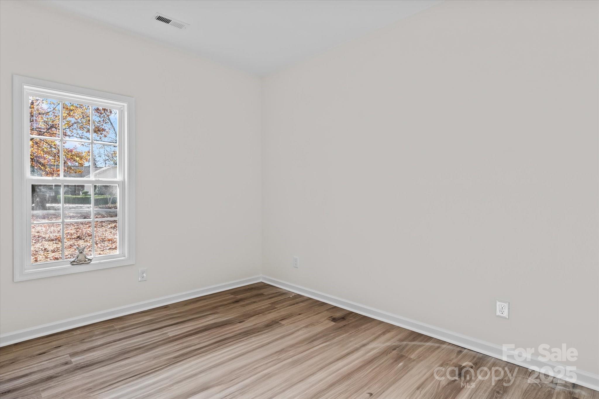 402 North Ward Avenue High Point, NC 27262 - Photo 15 of 24 a view of an empty room with wooden floor and a window