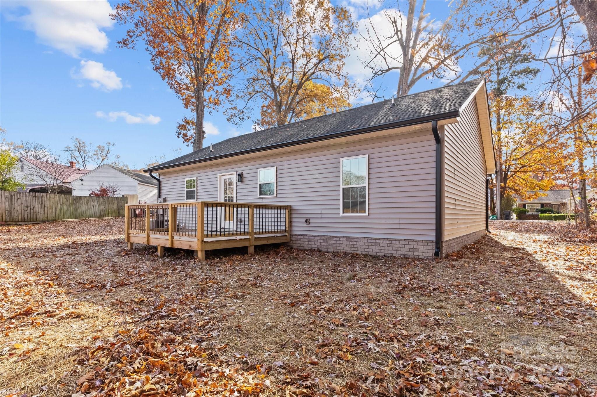 402 North Ward Avenue High Point, NC 27262 - Photo 21 of 24 a backyard of a house with wooden fence and deck