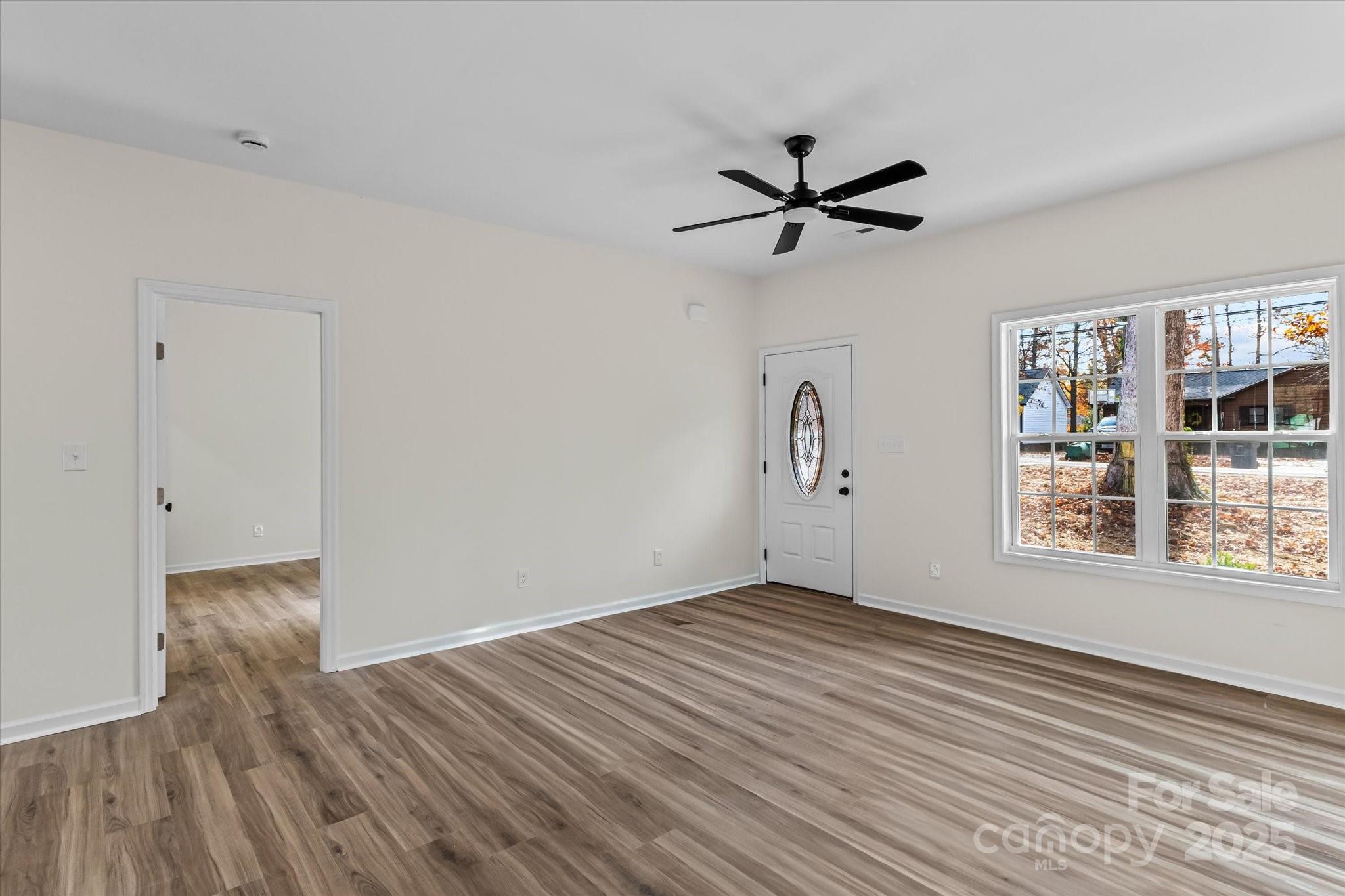 402 North Ward Avenue High Point, NC 27262 - Photo 3 of 24 wooden floor in an empty room with a window