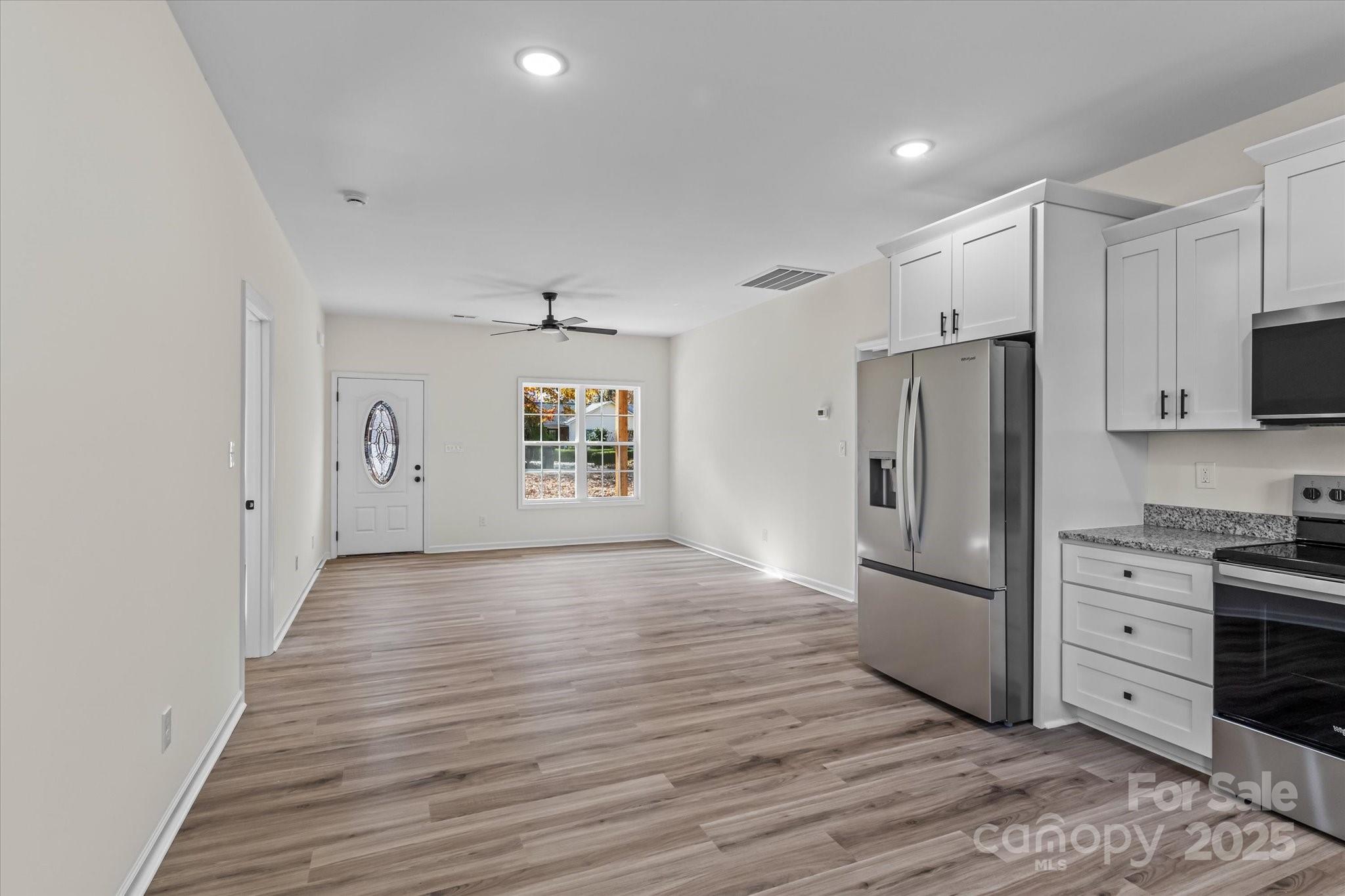 402 North Ward Avenue High Point, NC 27262 - Photo 5 of 24 a kitchen with stainless steel appliances a refrigerator and a stove top oven