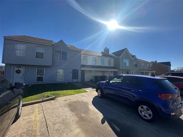 a car parked in front of a house