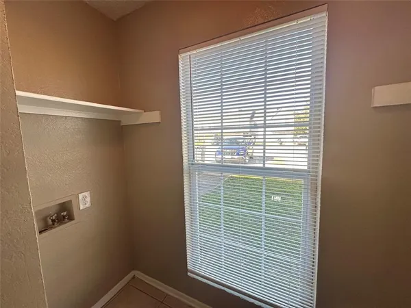 a view of a room that has a window in it