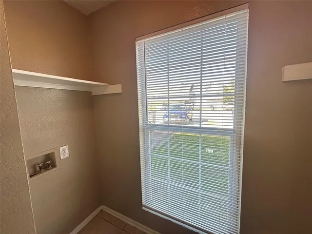 a view of a room that has a window in it