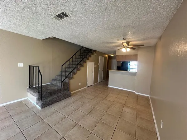 a view of entryway and hall with a front door
