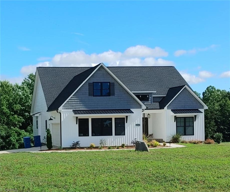 8805 Colgate Road Stokesdale, NC 27357 - Photo 26 of 34 3 bed, 2 bath home on 1.52 acres with open floor plan, vaulted and trey ceilings, open floor plan, solid surface counter tops, large primary bath and walk-in closet, large fenced back yard with garden boxes and cute chicken house.