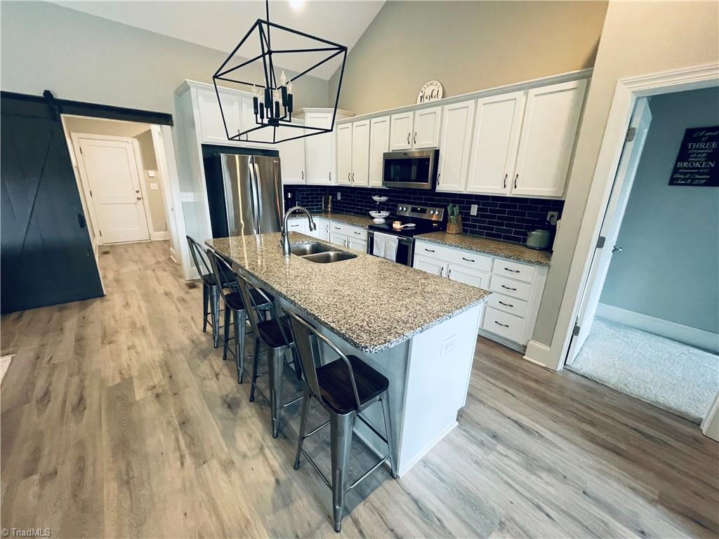 8805 Colgate Road Stokesdale, NC 27357 - Photo 4 of 34 View of kitchen looking into laundry, pantry and mud room