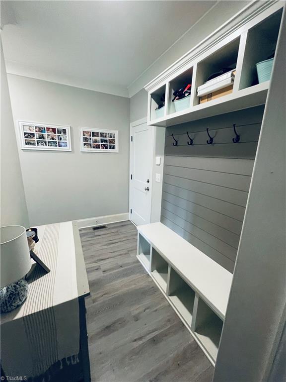 8805 Colgate Road Stokesdale, NC 27357 - Photo 18 of 34 Mud room area, with built in nooks, bench and coat hangers
