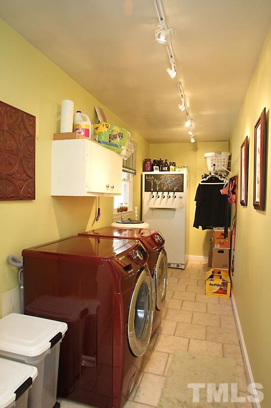 809 Currituck Drive Raleigh, NC 27609 - Photo 11 of 14 a utility room with dryer and washer