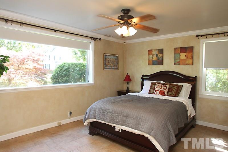 809 Currituck Drive Raleigh, NC 27609 - Photo 10 of 14 a bedroom with a bed and a window