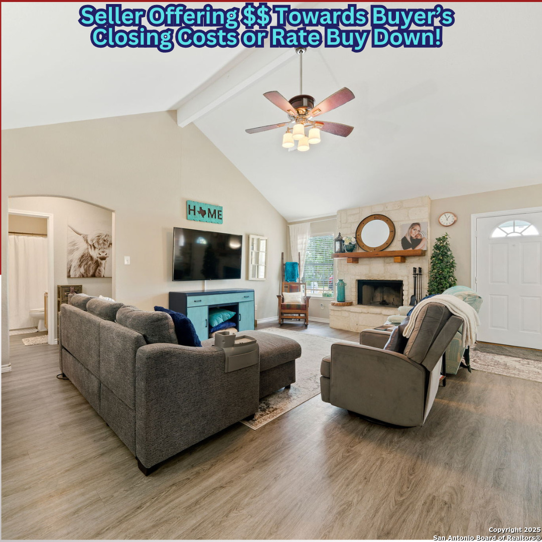169 County Road 6611 Devine, TX 78016 - Photo 1 of 1 a living room with furniture a fireplace and a flat screen tv