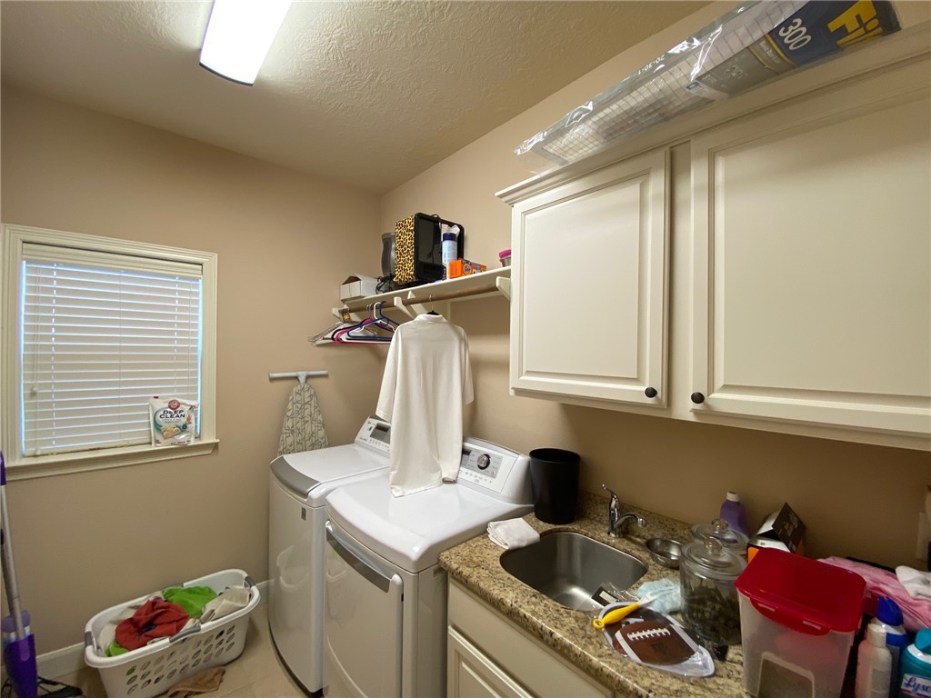 4261 Rocky Rhodes Drive College Station, TX 77845 - Photo 14 of 16 a utility room with dryer and washer