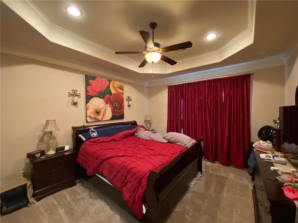 4261 Rocky Rhodes Drive College Station, TX 77845 - Photo 8 of 16 a bedroom with a bed and a chandelier