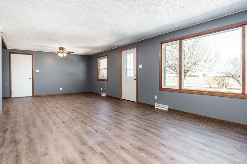 4422 North Union Road Forreston, IL 61030 - Photo 35 of 60 a view of an empty room with wooden floor and a window