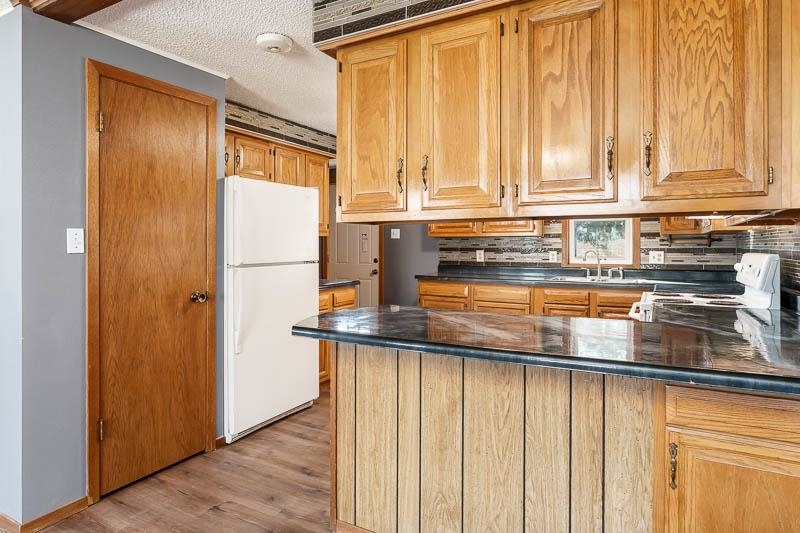 4422 North Union Road Forreston, IL 61030 - Photo 39 of 60 a kitchen with stainless steel appliances granite countertop a refrigerator and a sink