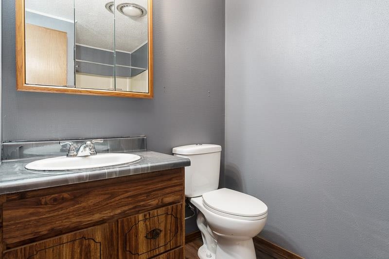 4422 North Union Road Forreston, IL 61030 - Photo 48 of 60 a bathroom with a sink and a toilet