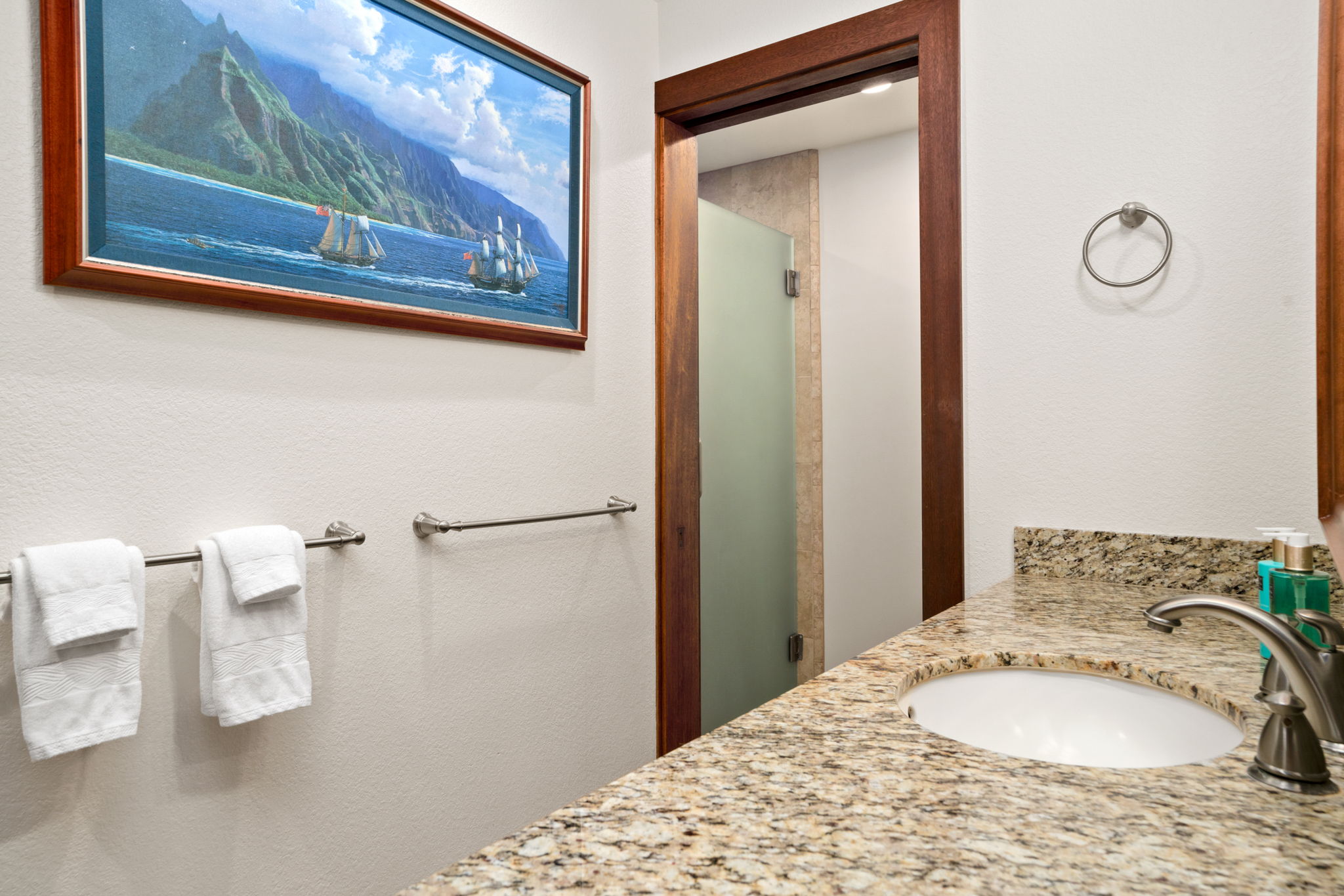 2221 Kapili Road, Unit 25 Koloa, HI 96756 - Photo 5 of 6 a bathroom with a sink and mirror with toilet