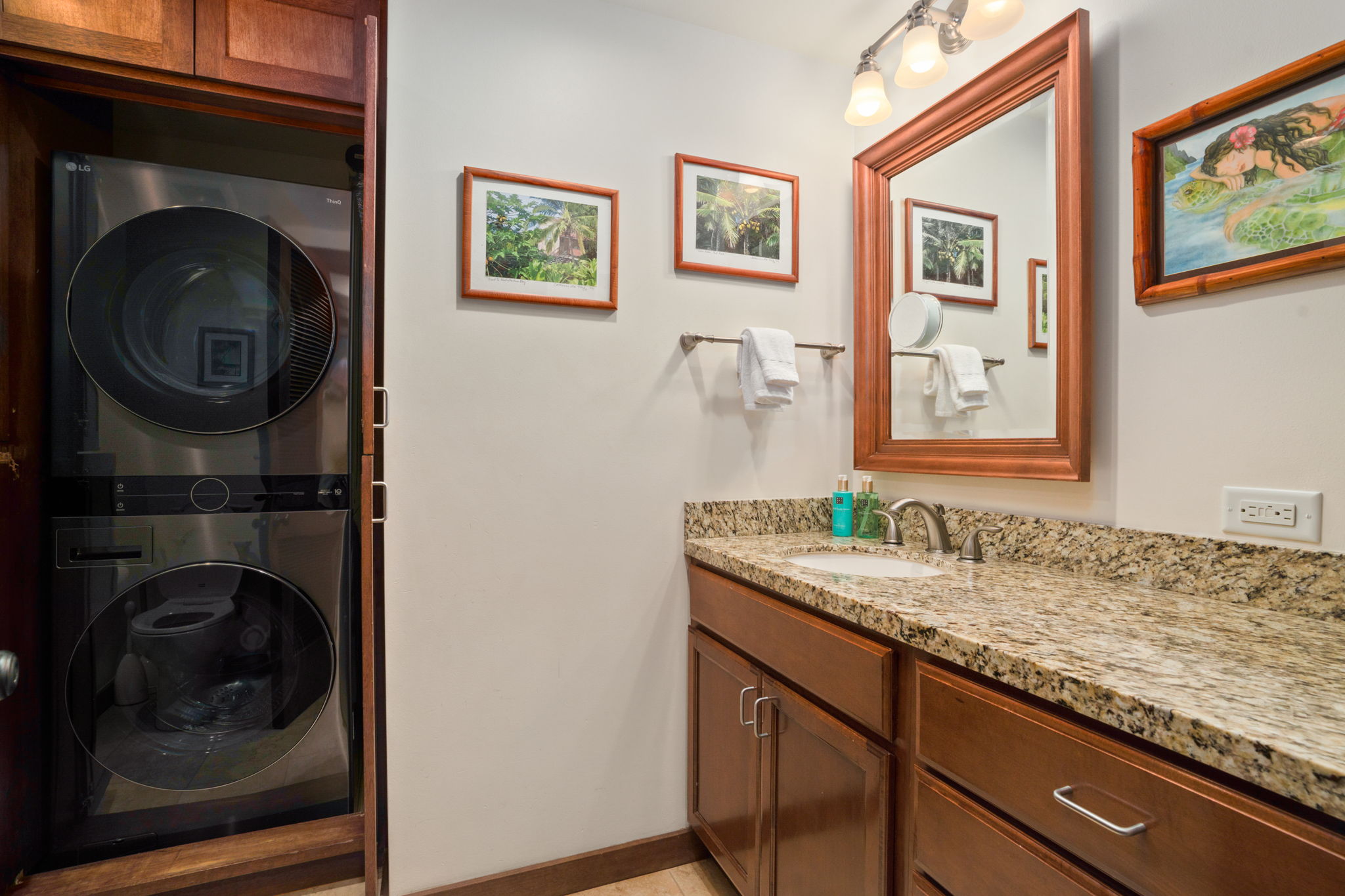 2221 Kapili Road, Unit 25 Koloa, HI 96756 - Photo 6 of 6 a bathroom with a sink and a mirror