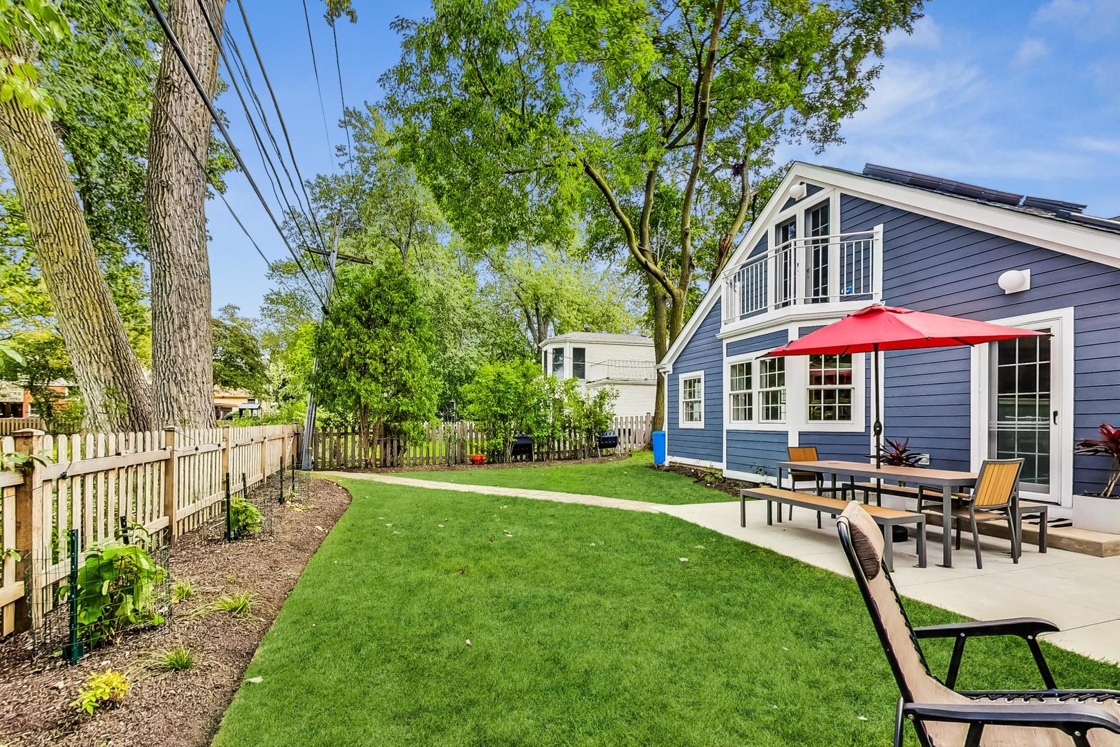 48 Williamsburg Road Evanston, IL 60203 - Photo 39 of 42 a view of a house with backyard and sitting area