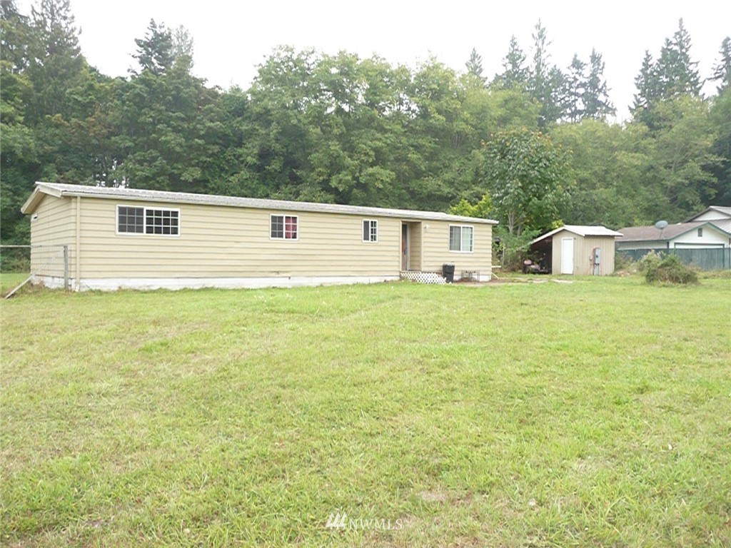 181 Head Gate Road Sequim, WA 98382 - Photo 1 of 18 a house view with a garden space