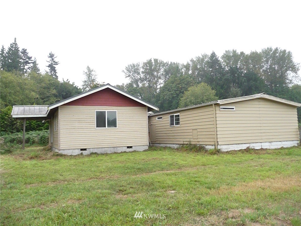 181 Head Gate Road Sequim, WA 98382 - Photo 5 of 18 a view of a house with a yard