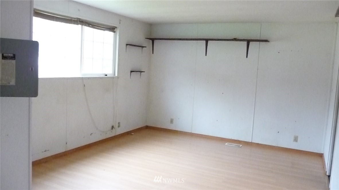 181 Head Gate Road Sequim, WA 98382 - Photo 9 of 18 a view of an empty room with a window