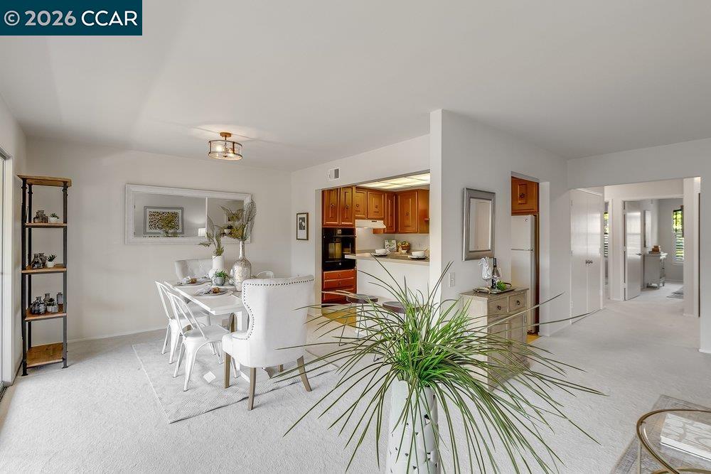 2801 Golden Rain Road, Unit 3 Walnut Creek, CA 94595 - Photo 11 of 29 a view of a livingroom with furniture and a rug