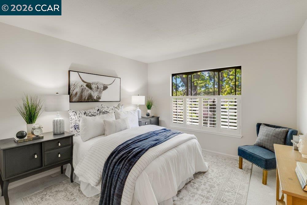 2801 Golden Rain Road, Unit 3 Walnut Creek, CA 94595 - Photo 19 of 29 a bedroom with a bed and wooden floor