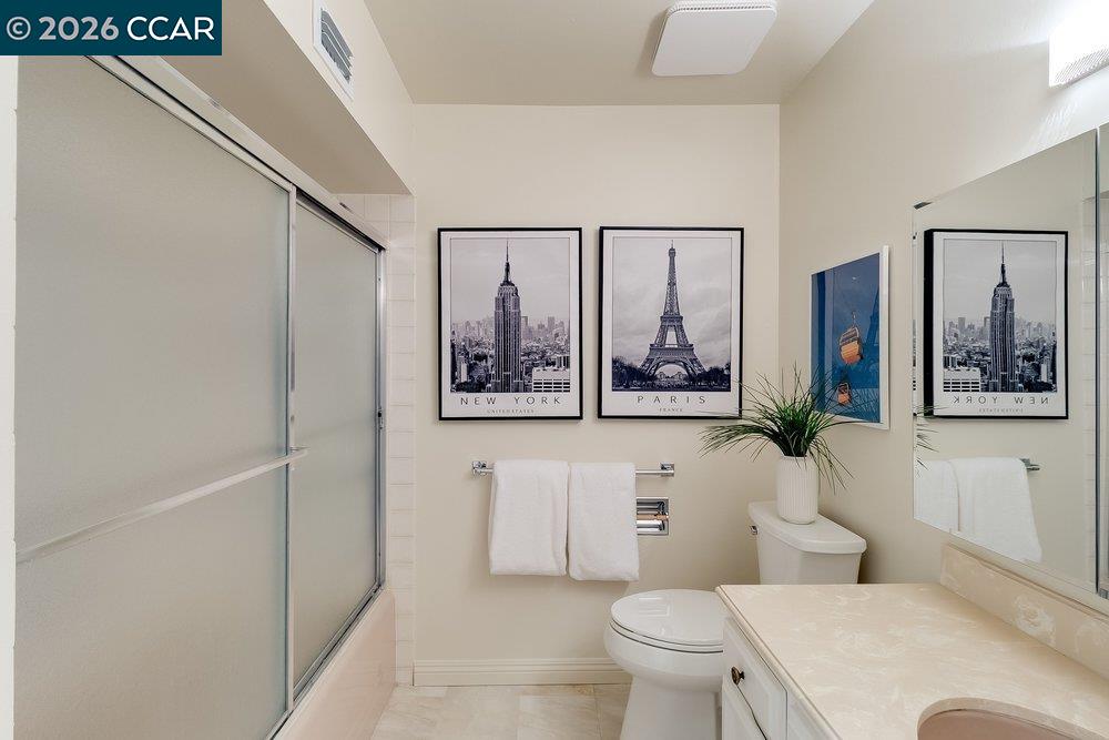 2801 Golden Rain Road, Unit 3 Walnut Creek, CA 94595 - Photo 21 of 29 a white toilet sitting next to a bathroom sink