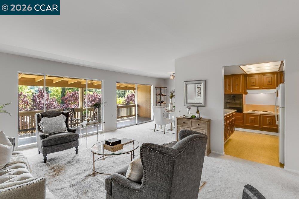 2801 Golden Rain Road, Unit 3 Walnut Creek, CA 94595 - Photo 7 of 29 a living room with furniture and a fireplace