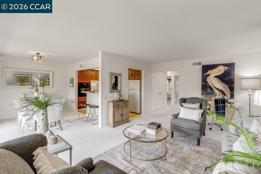 2801 Golden Rain Road, Unit 3 Walnut Creek, CA 94595 - Photo 8 of 29 a living room with furniture and wooden floor