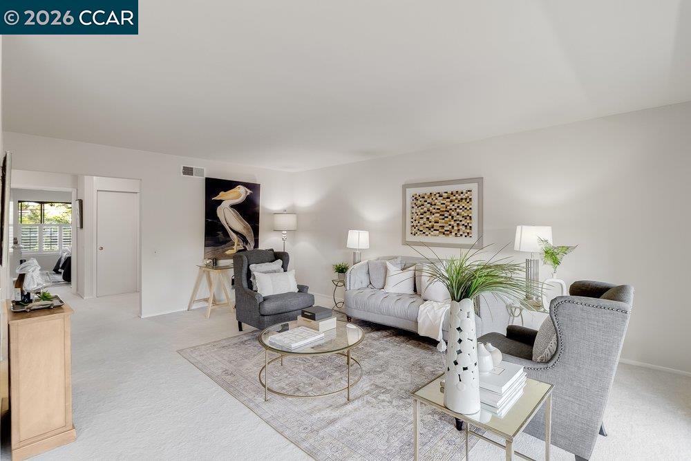 2801 Golden Rain Road, Unit 3 Walnut Creek, CA 94595 - Photo 9 of 29 a living room with furniture and wooden floor
