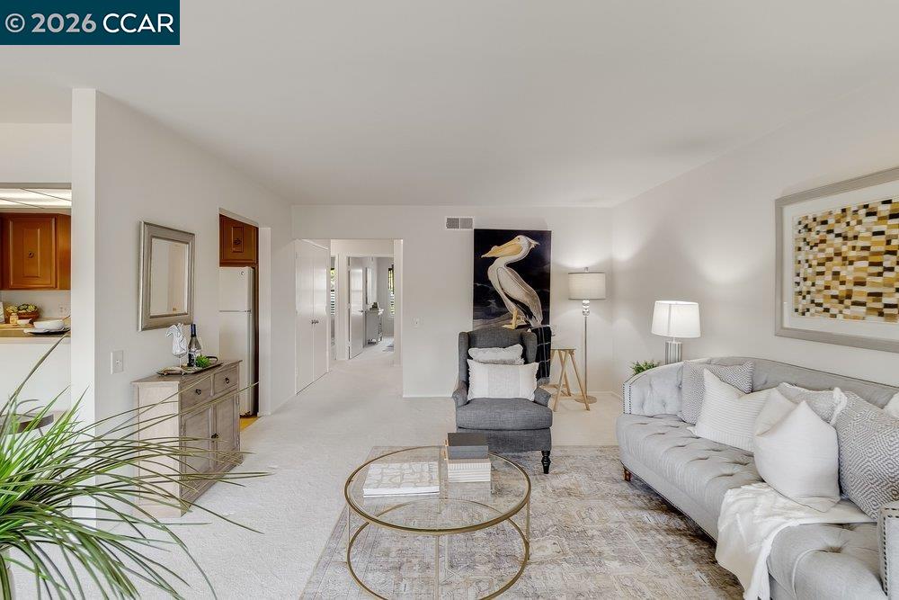 2801 Golden Rain Road, Unit 3 Walnut Creek, CA 94595 - Photo 10 of 29 a living room with furniture and a wooden floor