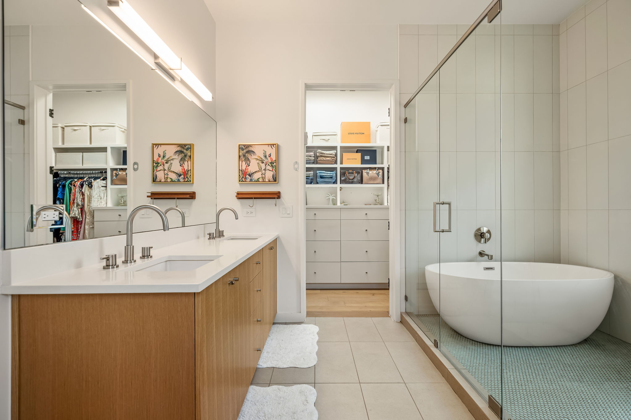 1811 Collier Street Austin, TX 78704 - Photo 18 of 40 Bathroom featuring a walk in closet, a shower stall, light tile patterned flooring, double vanity, and a freestanding bath