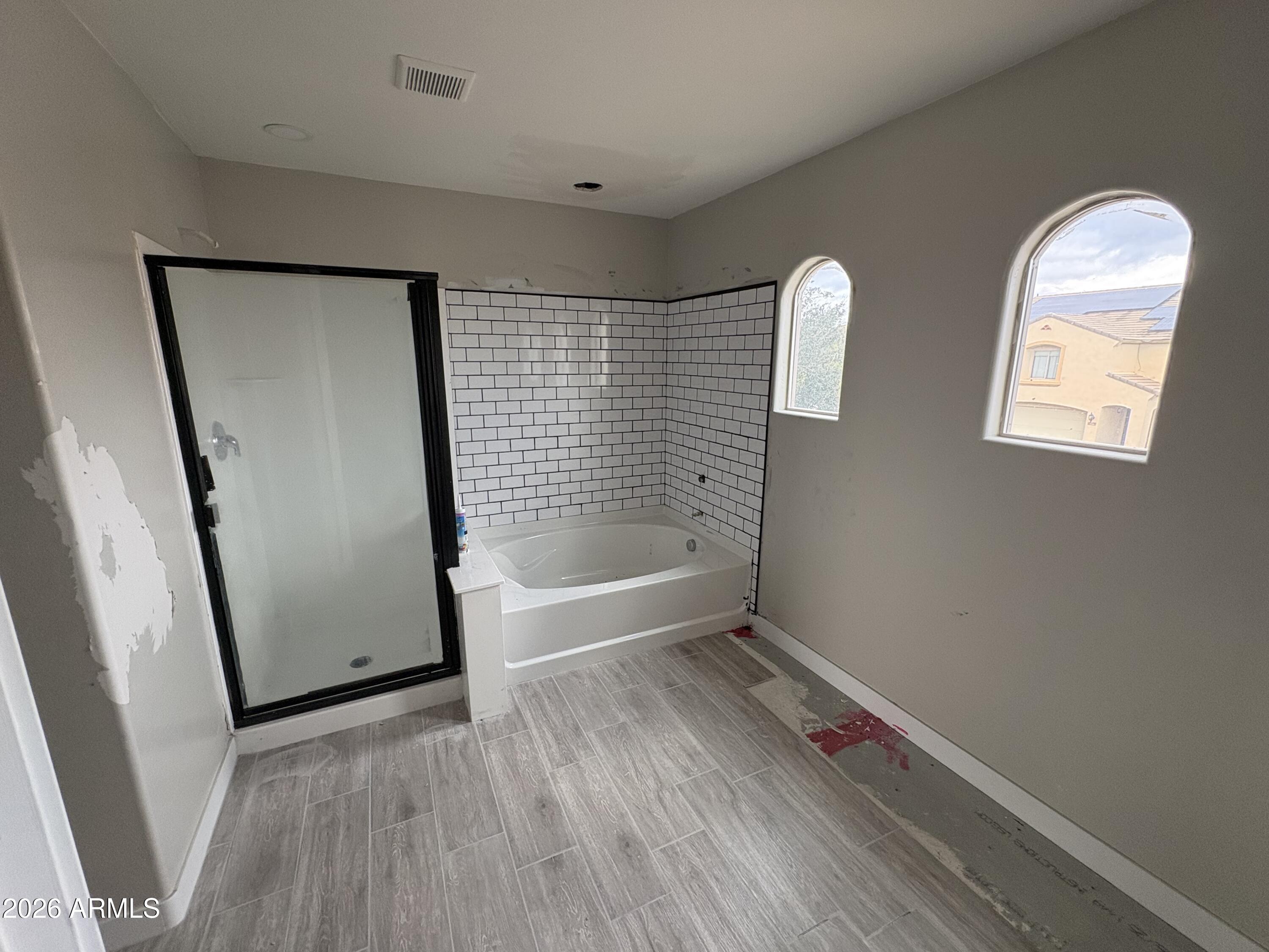 951 West Elizabeth Way Coolidge, AZ 85128 - Photo 12 of 20 wooden floor in an empty room with a window