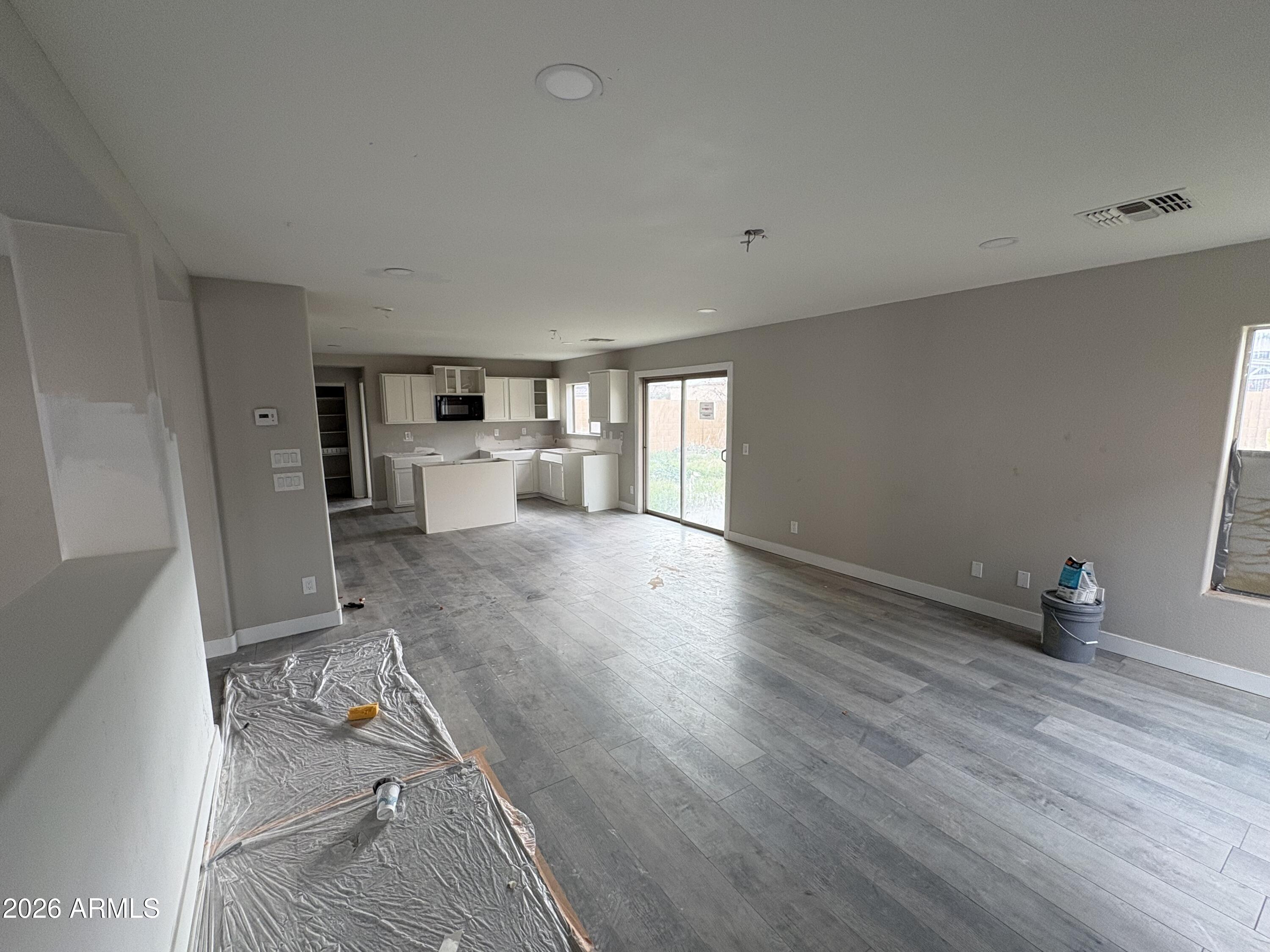 951 West Elizabeth Way Coolidge, AZ 85128 - Photo 3 of 20 a living room with furniture and a wooden floor
